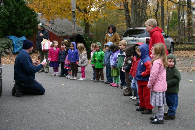 Students from the Boulder Knoll Montessori School learn about smoke detectors.