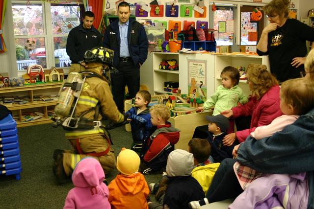 A CFD Fire Fighter greets the students.